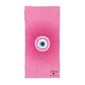 Pink towel with a circular design and 'Yola' branding on a white background