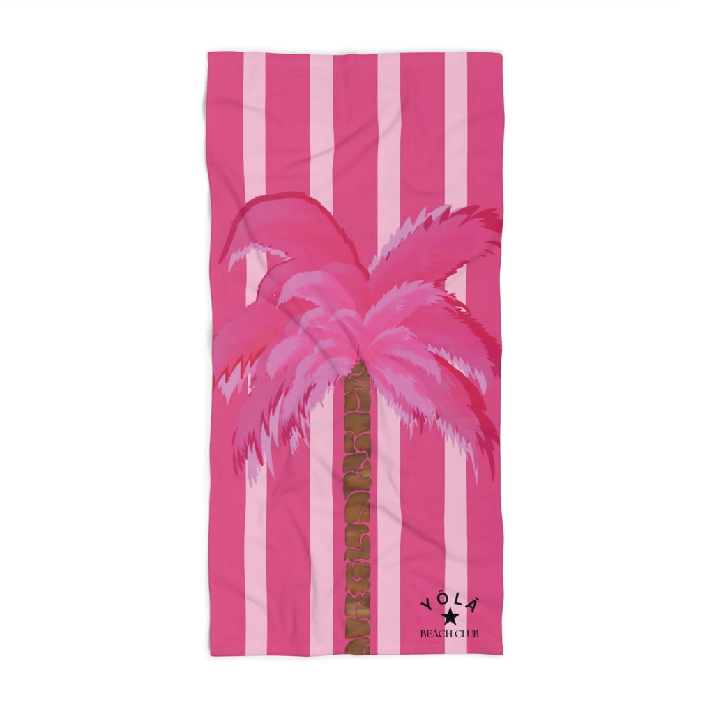 Pink beach towel with flamingo design and stripes on a white background