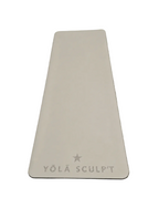 A light beige rectangular silicone mold with rounded corners, featuring the embossed text 'YŌLĀ SCULPT' and a star logo at the bottom, displayed on a textured gray surface.