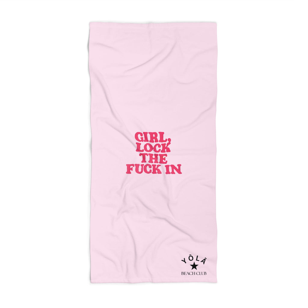 Pink towel with red text on a white background