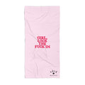 Pink towel with red text on a white background