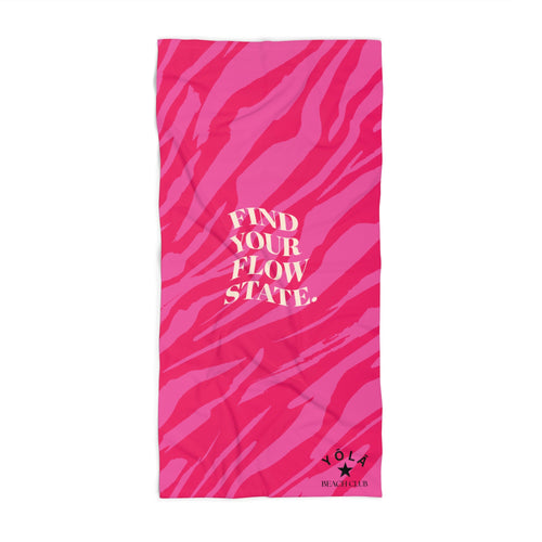 Pink towel with zebra pattern and text on a white background