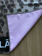 Leopard print Pilates grip towel detail showing premium microfiber suede surface and stitched edge by YŌLĀ SCULP'T