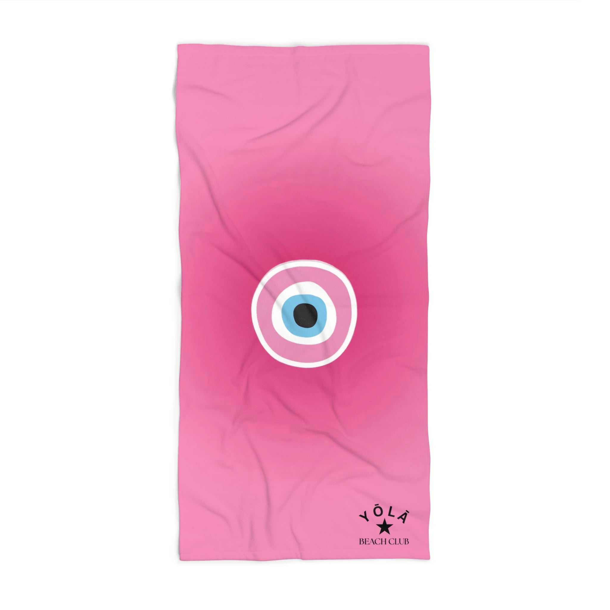 Pink towel with a circular design and 'Yola' branding on a white background