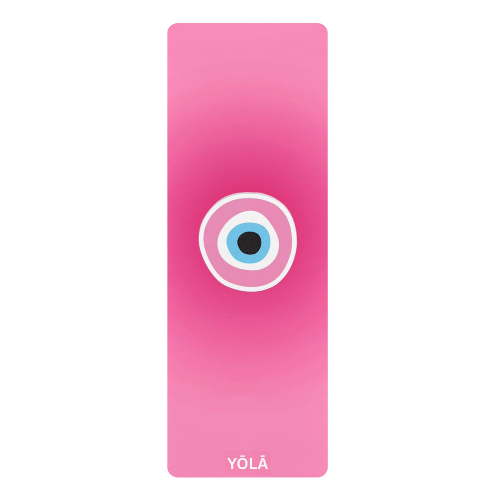 Pink yoga mat with a circular design and 'YOLA' branding on a white background