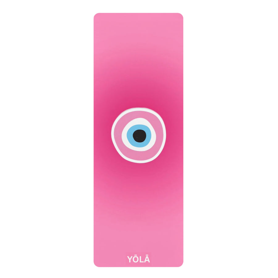 Pink yoga mat with a circular design and 'YOLA' branding on a white background