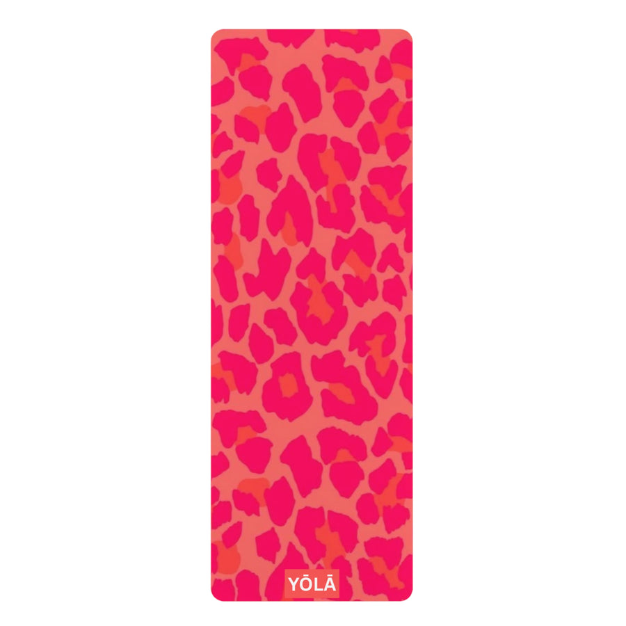 Pink leopard print yoga mat with bright neon pink and coral animal print pattern and YOLA logo at the bottom.
