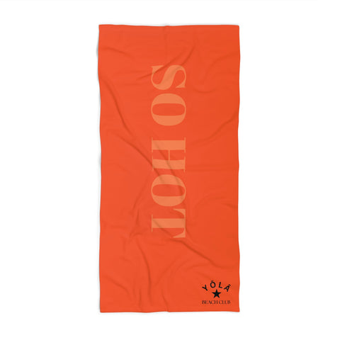 Orange towel with 'SO HOT' text and a brand logo on a white background