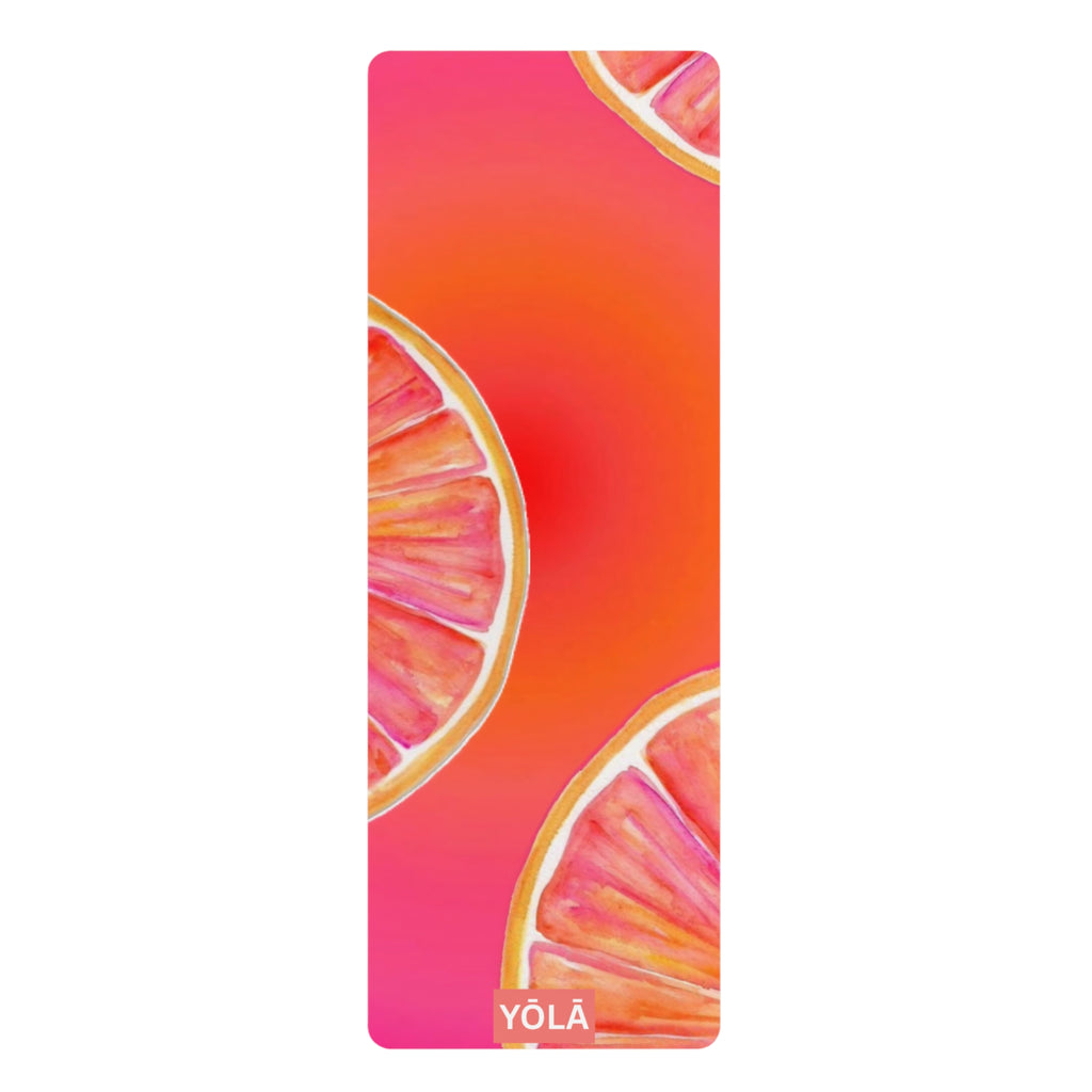 Yoga mat with pink and orange design featuring the brand 'Yola' on a white background