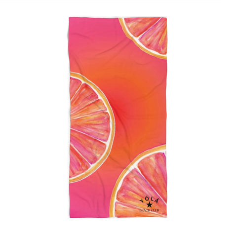Towel with orange slice design on a pink background