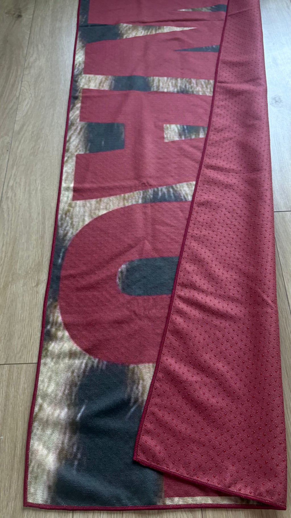 SWAG leopard print Pilates grip towel with bold burgundy typography, non-slip microfiber suede with silicone dots on back by YŌLĀ SCULP'T